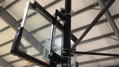 Basketball goal with electric height adjuster